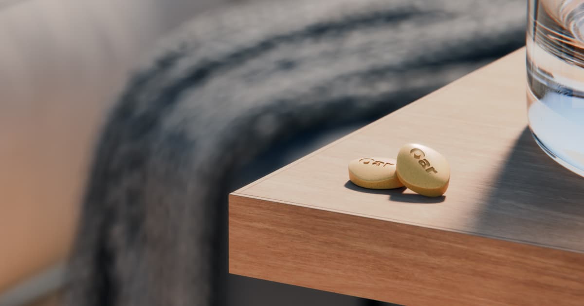 How naltrexone works to transform your relationship with alcohol. Two naltrexone pills on a bedside.